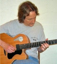 George Seccombe of Alpine Music Studios Playing Guitar